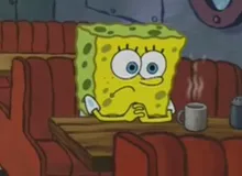 Spongebob squarepants holding a TBD sign